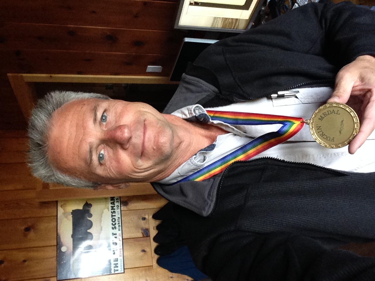 Glenn Reid with the medal Steve Jobs had made